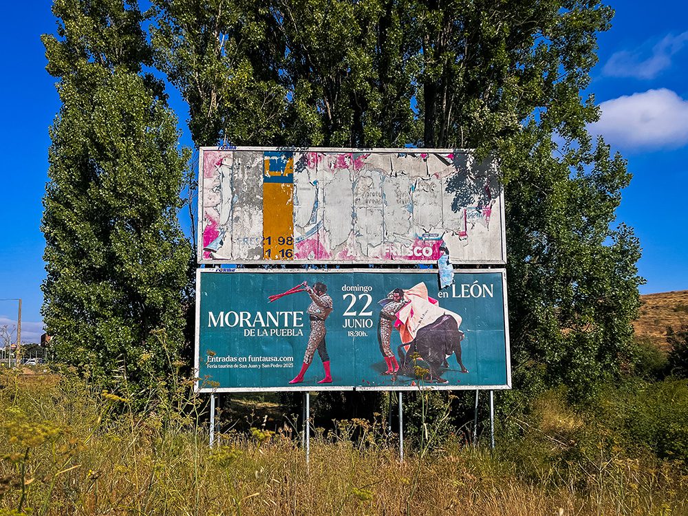 Bullfighting poster beside the Camino Francés on the approach to León