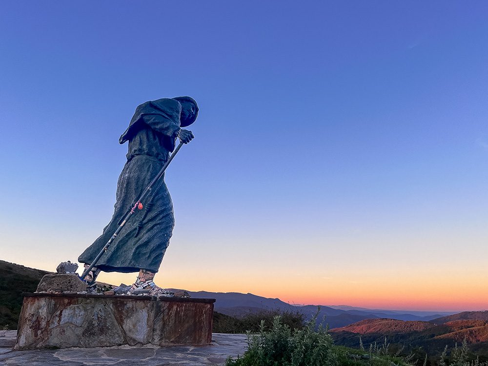 Monumento do Peregrino medieval pilgrim statue at sunrise on the Camino Francés near O Cebreiro