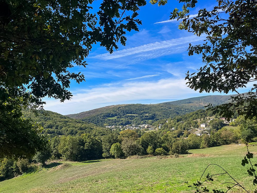 View across the wooded Galician hills towards Triacastela on the Camino Francés